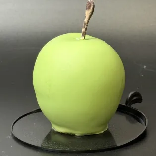 Apple-shaped dessert with pecan biscuit, apple cinnamon filling, and caramel mousse